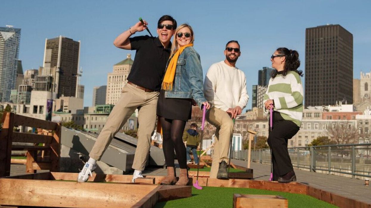People play on a new new mini golf activity in Montreal.