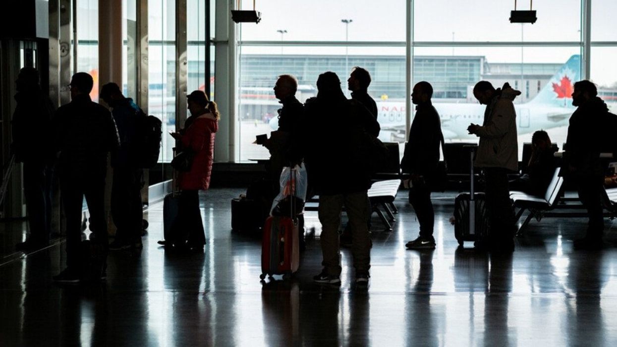 People wait around at Montreal Airport.