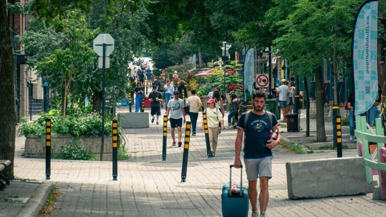 People walk along avenue Duluth Est, a tree-lined pedestrian street in Montreal's Plateau-Mont-Royal.