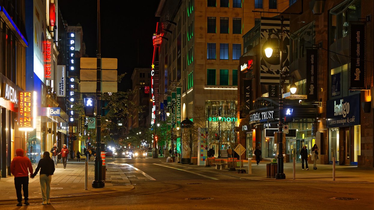 People walk along Sainte-Catherine street in Montreal.