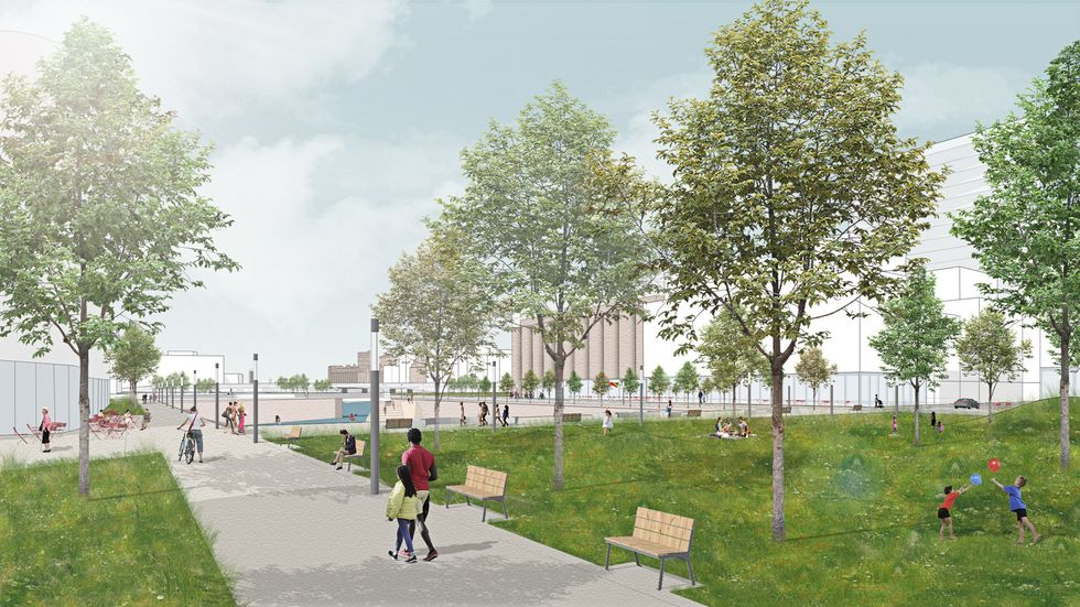 People walk down a path toward Silo no. 5.