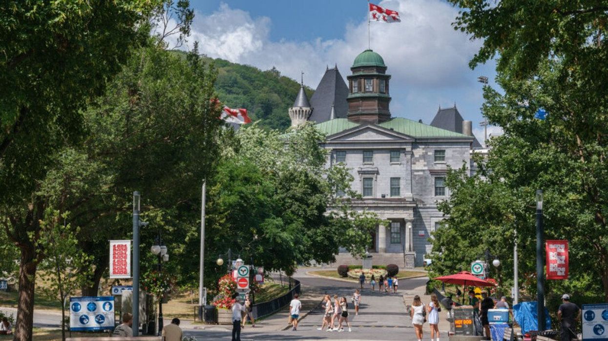 People walk in front of the McGill Arts building.