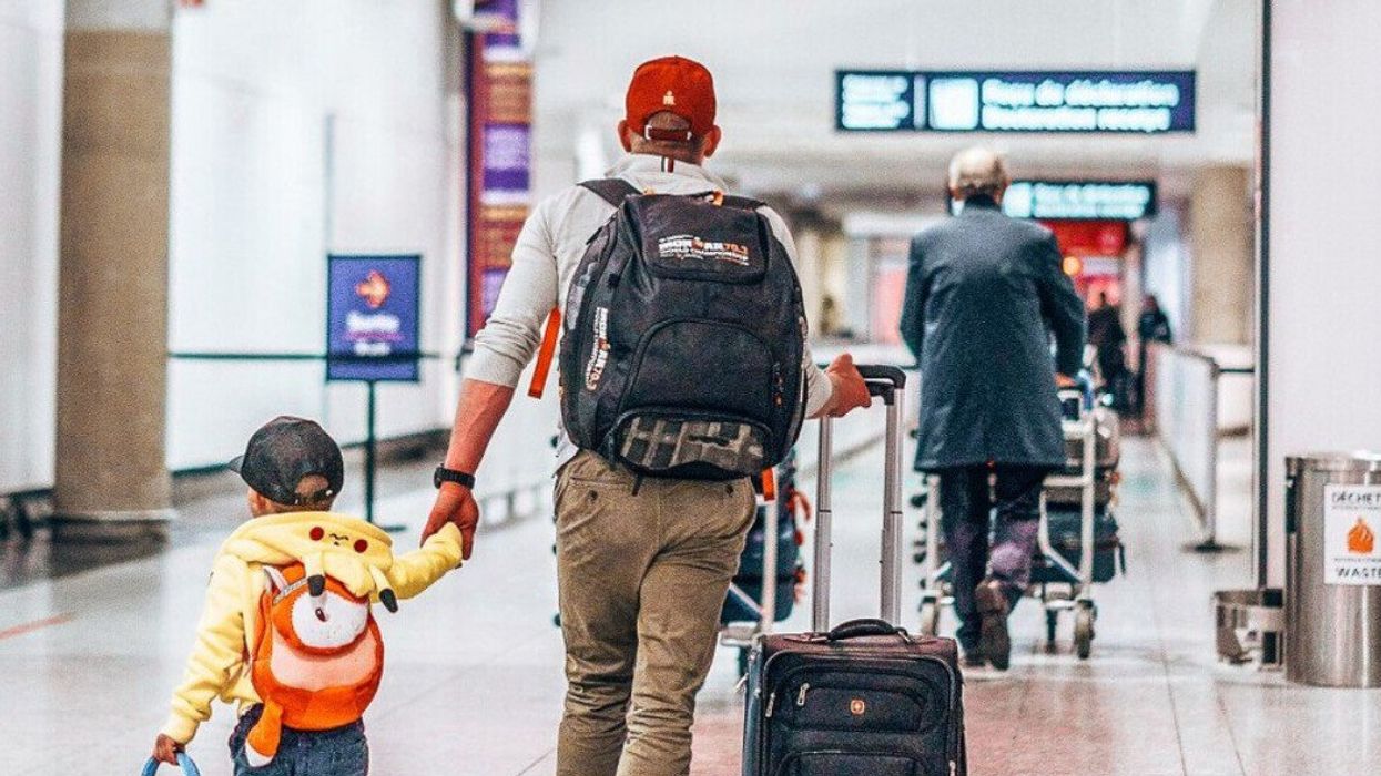 People walk through Montreal Airport (YUL).