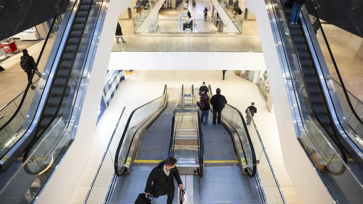 People walk through the Montreal Eaton Centre.