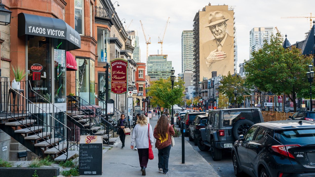 People walking on Crescent Street. Montreal, Quebec, Canada. Montreal, Quebec, Canada - October 16 2022 : People walking on Crescent Street, a popular attraction for both tourists and locals.
