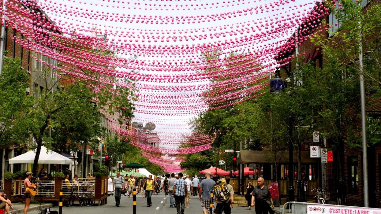 People walking through the decorated Gay Village in Ville-Marie during the summer in Montreal, Quebec.