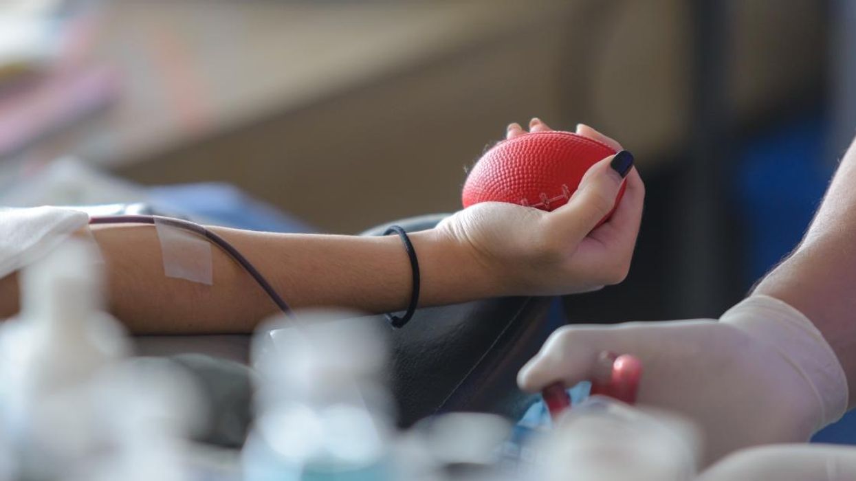 Person donating blood.