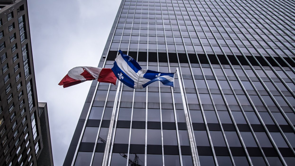Quebec, Canada flags on building.