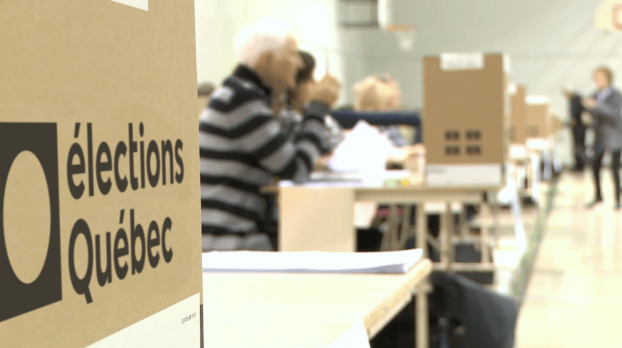 Quebec polling station with the Élections Québec logo visible.
