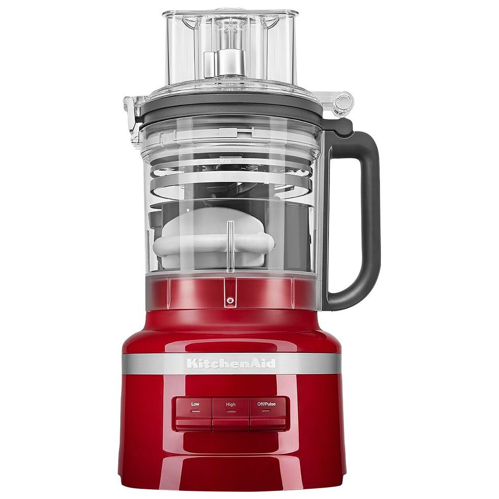Red KitchenAid food processor with large capacity bowl and pulse controls.