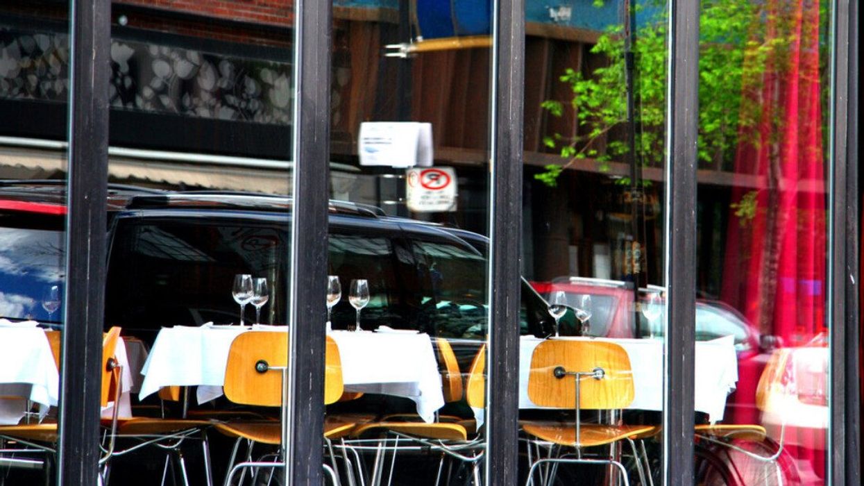 Restaurant reflection (blur). Reflection in a restaurant windows in downtown Montreal, Quebec, Canada. Taken from a driver seat.