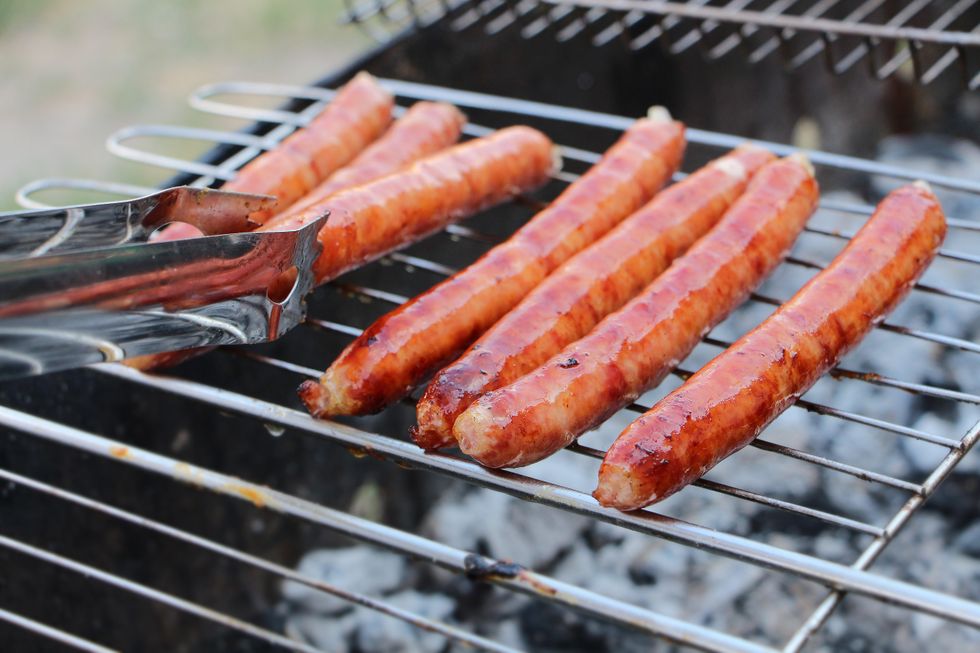 Sausages being grilled on a barbecue