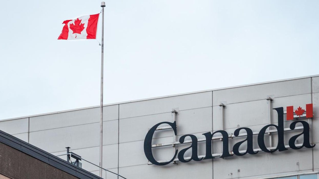 Service Canada building with Canadian flag.