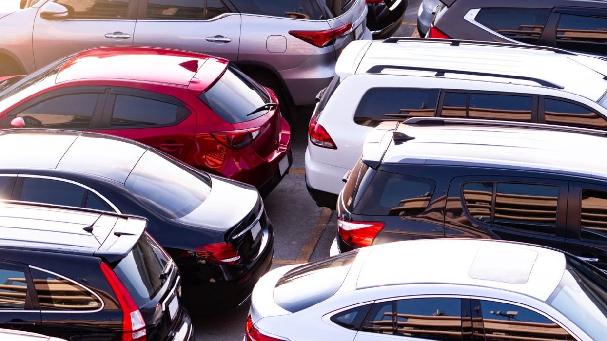 Several cars parked in a parking lot.