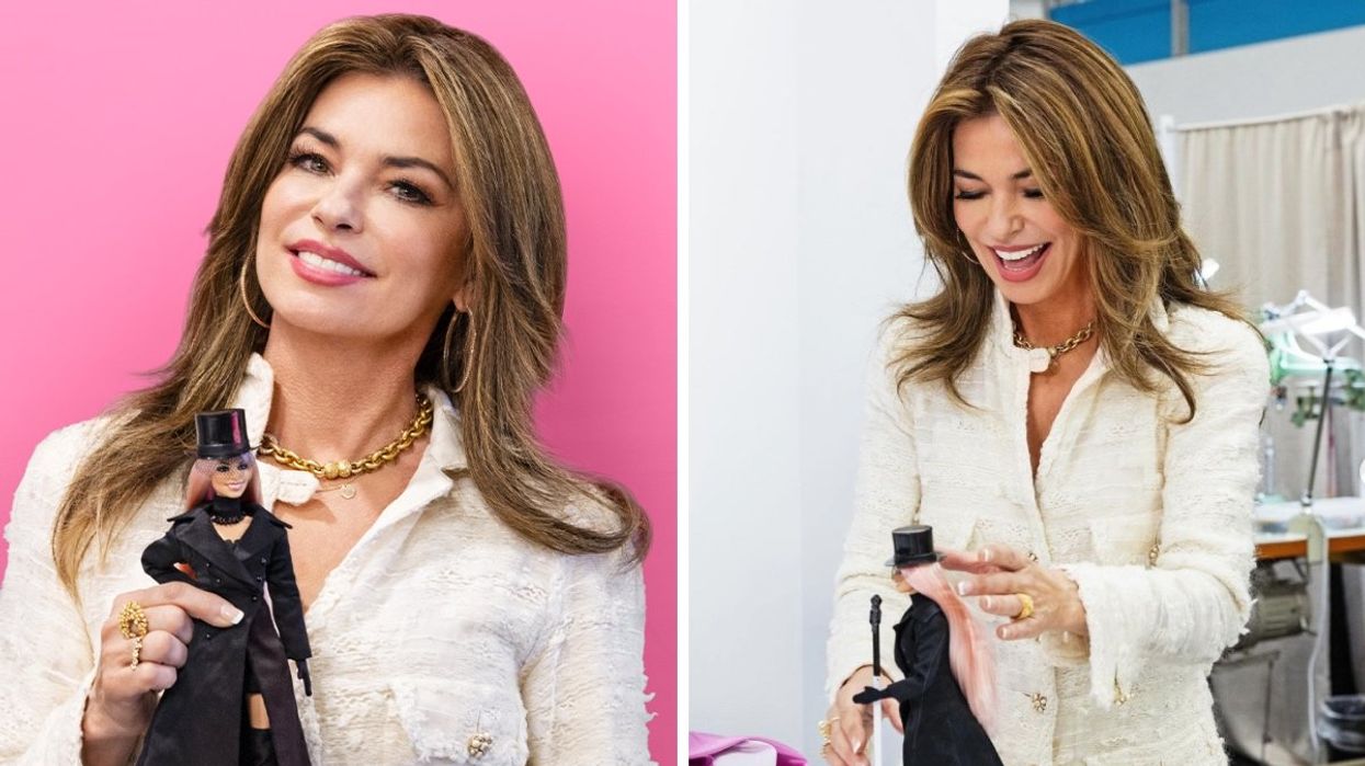 Shania Twain holding her new Barbie doll.