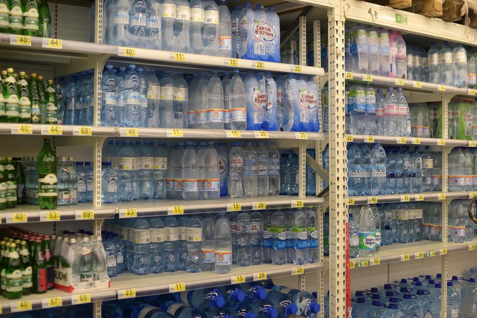 Shelves full of water bottles.