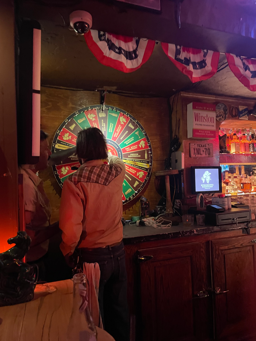 Someone spins a wheel that offers prizes or disappointment.