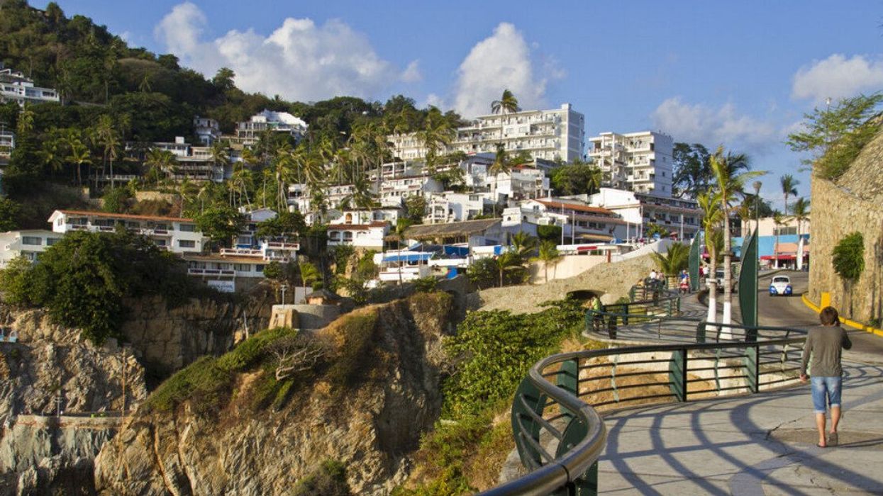 Someone walks up the embankment in Acapulco, Mexico.