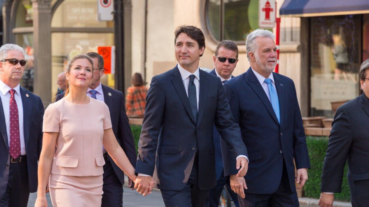 Sophie Grégoire and Justin Trudeau hold hands in Montreal.