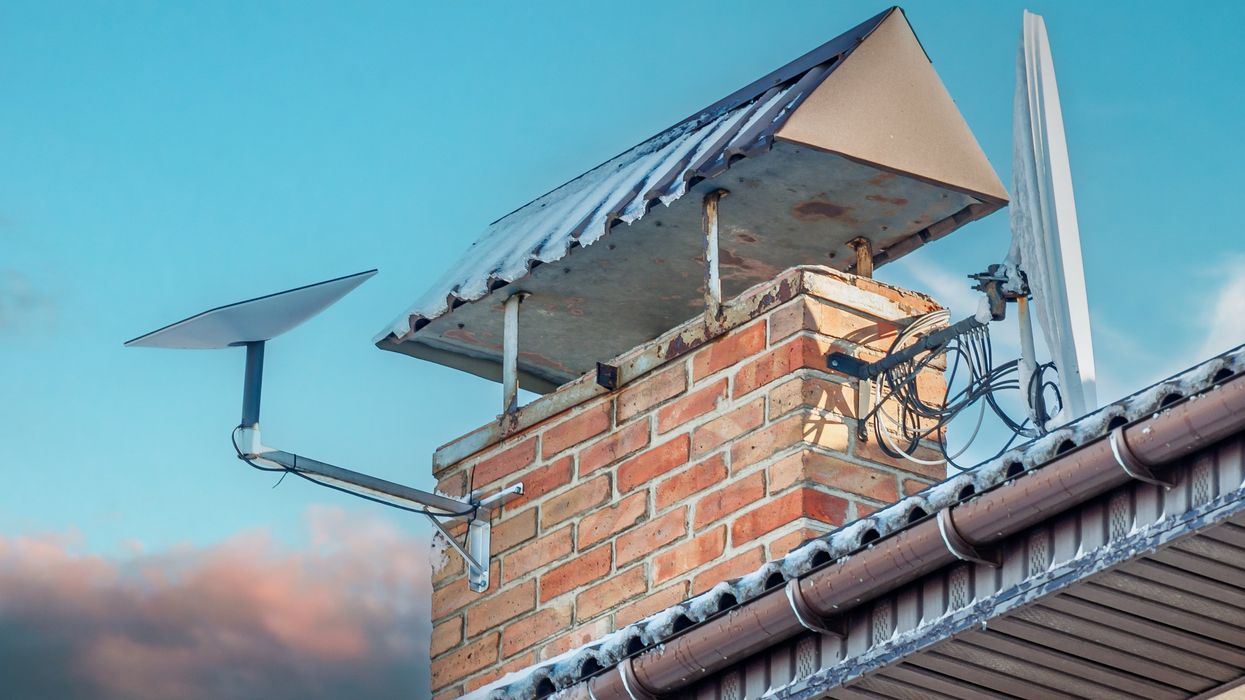 Starlink satellite dish on a house chimney.