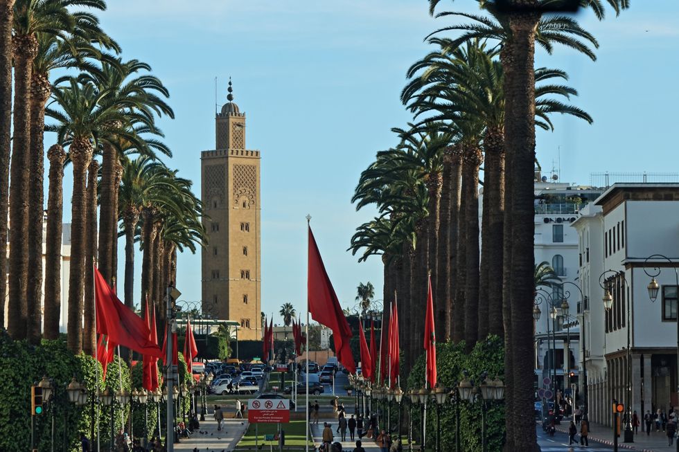 Street lined by palm trees in Rabat, Morocco.