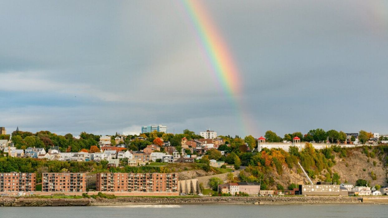 Sunset with a rainbow over Lévis and St Lawrence River.