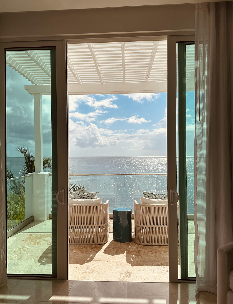 The airy, relaxed bedroom in one of Windjammer Landing's hillside villas.