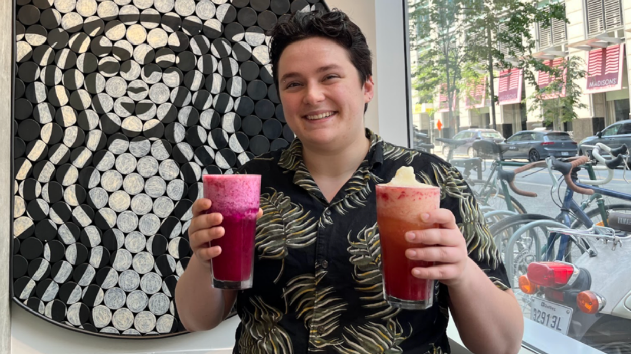 The author holding two of the new frozen Refreshers from Starbucks.