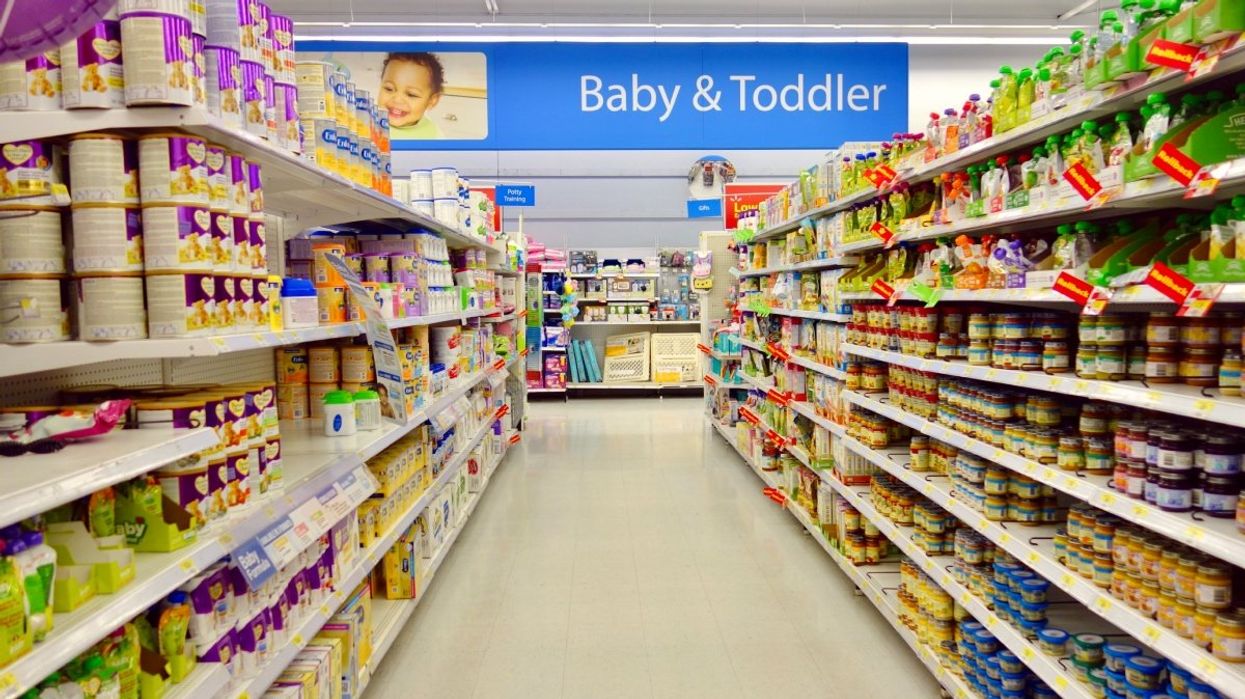 The baby and toddler aisle at a department store including baby formula, baby food and baby care products.
