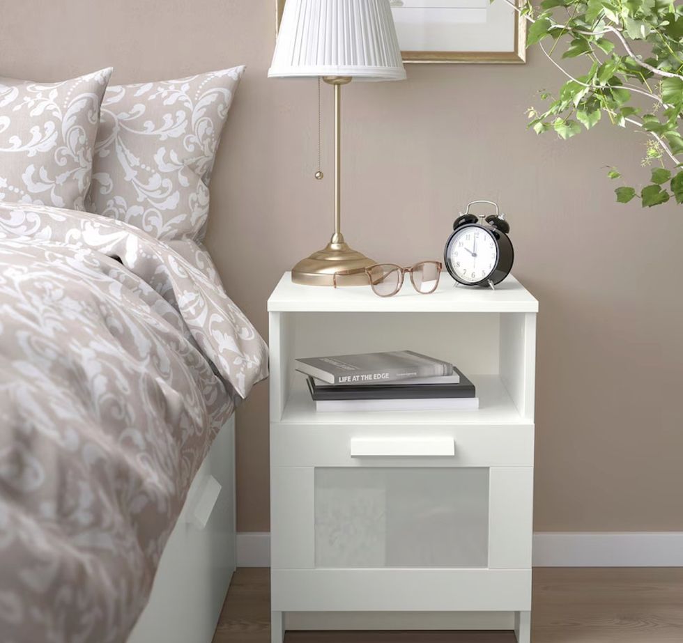 The BRIMNES nightstand holding bedtime essentials.