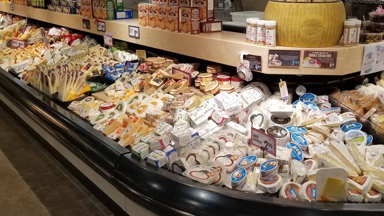The cheese section of a grocery store.
