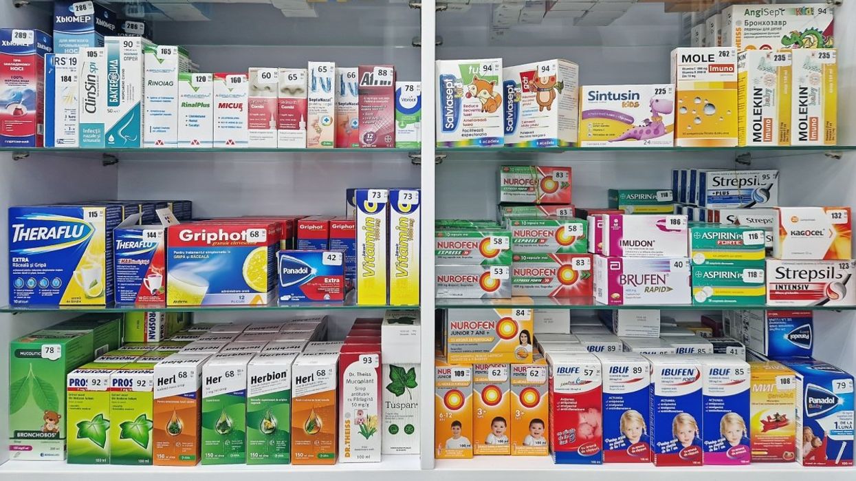 The cold and flu medicine section at a pharmacy.