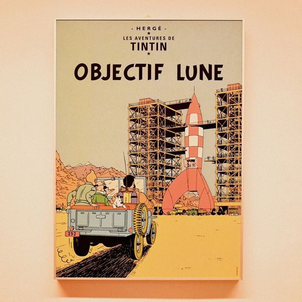 The cover of Tintin comic "Objectif Lune" with a car of astronauts driving toward a rocket.