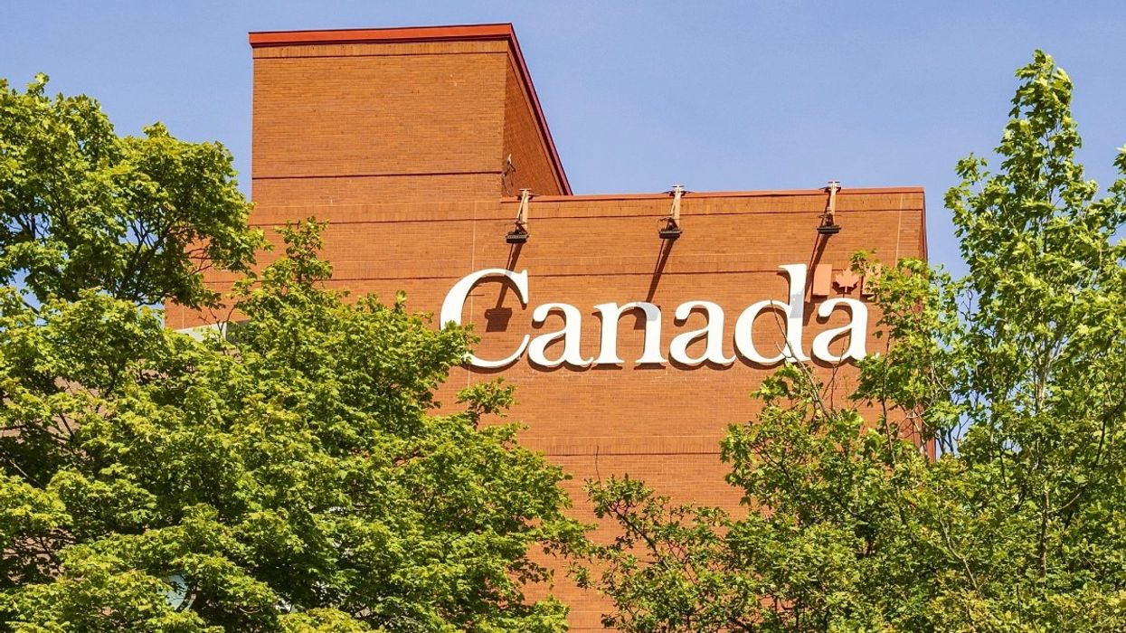 The exterior of a Government of Canada building during the summertime.