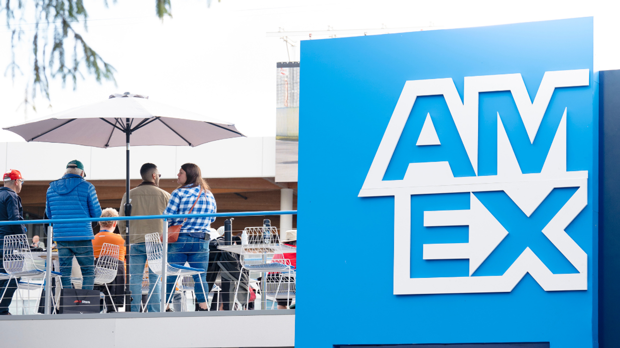 The exterior of the Trackside Lounge with a blue entryway reading "Amex.