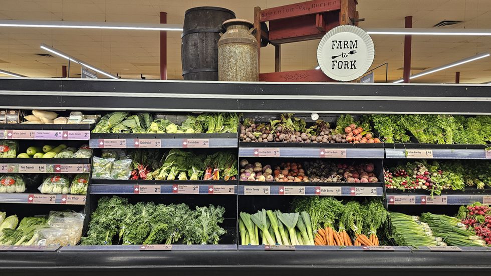 The fresh produce section at Farm Boy grocery store, under a sign that reads "farm to fork."