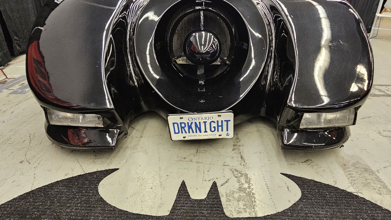 The front of the Batmobile, with a license plate that reads "DRKNIGHT."