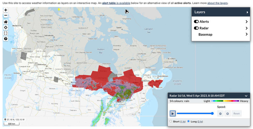The interactive ECCC map with layers showing weather radar (blotches of green, blue and yellow) and areas subject to weather warnings (patches of red).