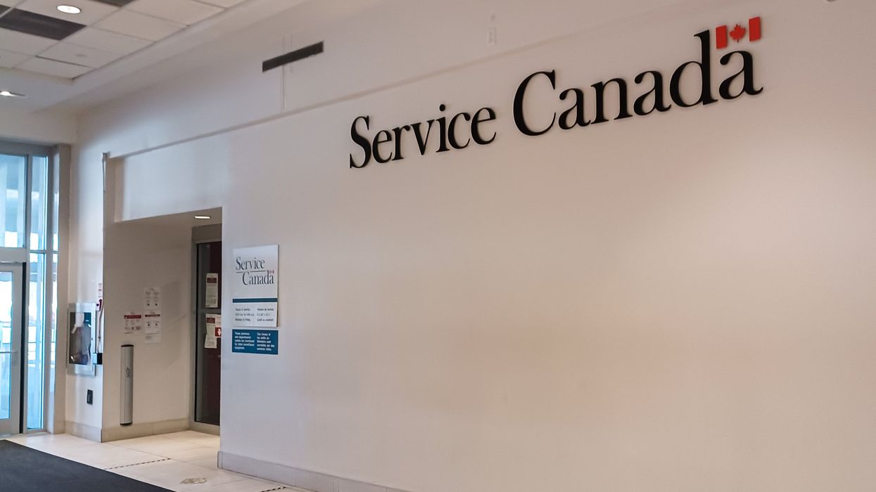 The interior of a Service Canada building, with a large Service Canada sign.