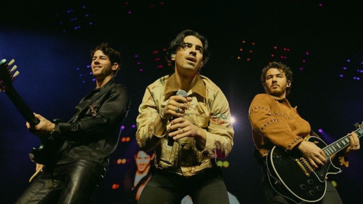 The Jonas Brothers performing on stage.