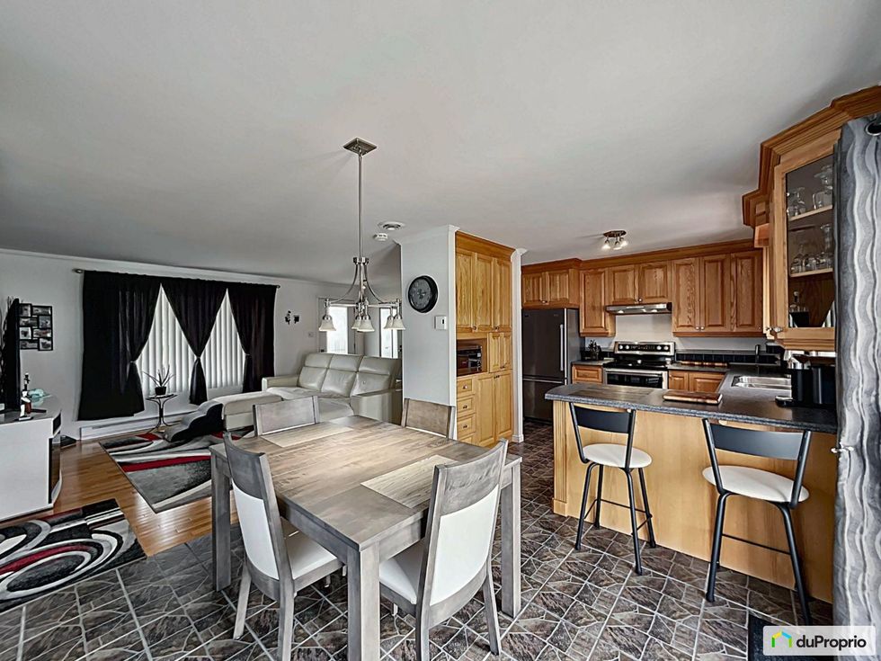 The kitchen and living room.