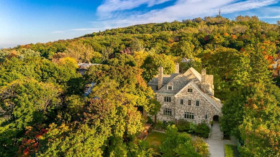 The Lalibert\u00e9 mansion among the trees of Mount Royal.