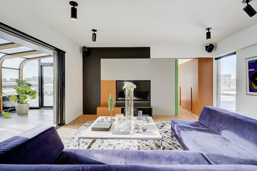 The main living space in the Habitat 67 condo for sale.
