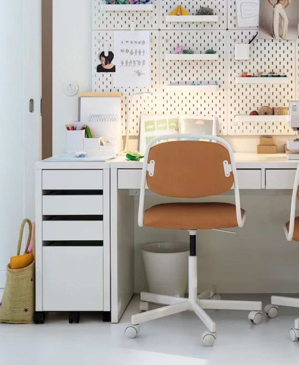 The MICKE drawer unit as part of a desk.