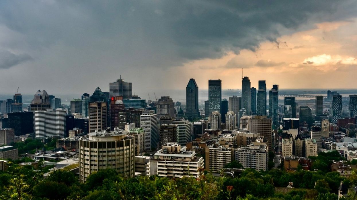 The Montreal skyline during a thunderstorm in the summer taken from the Mont-Royal lookout.