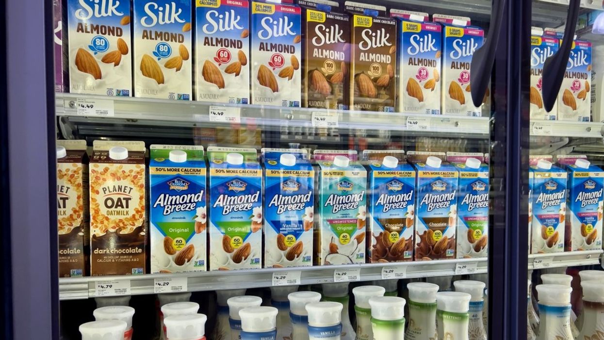 The plant-based milk section at a grocery store. 