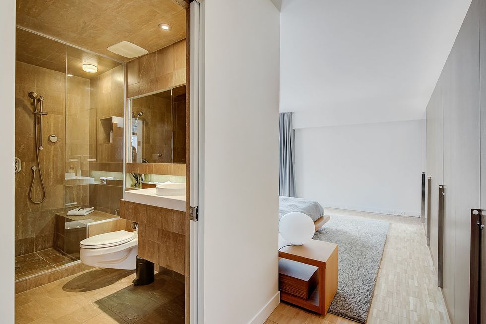 The primary bedroom and en suite bathroom.