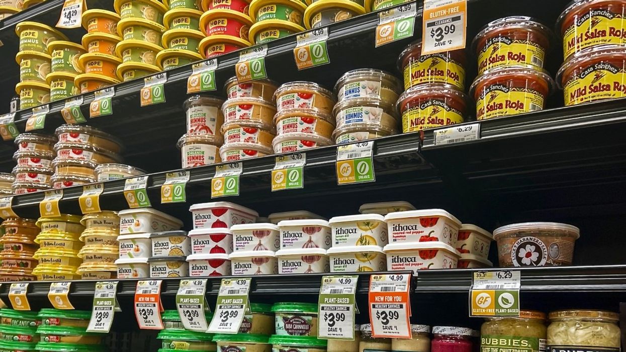 the salsa and dip aisle at a grocery store in North America.