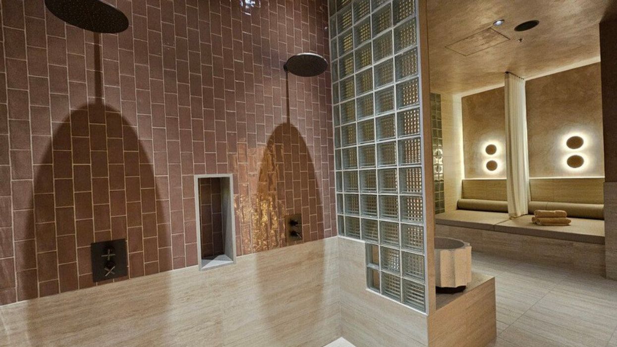 The salt scrub shower near lounge seating in the thermal room.