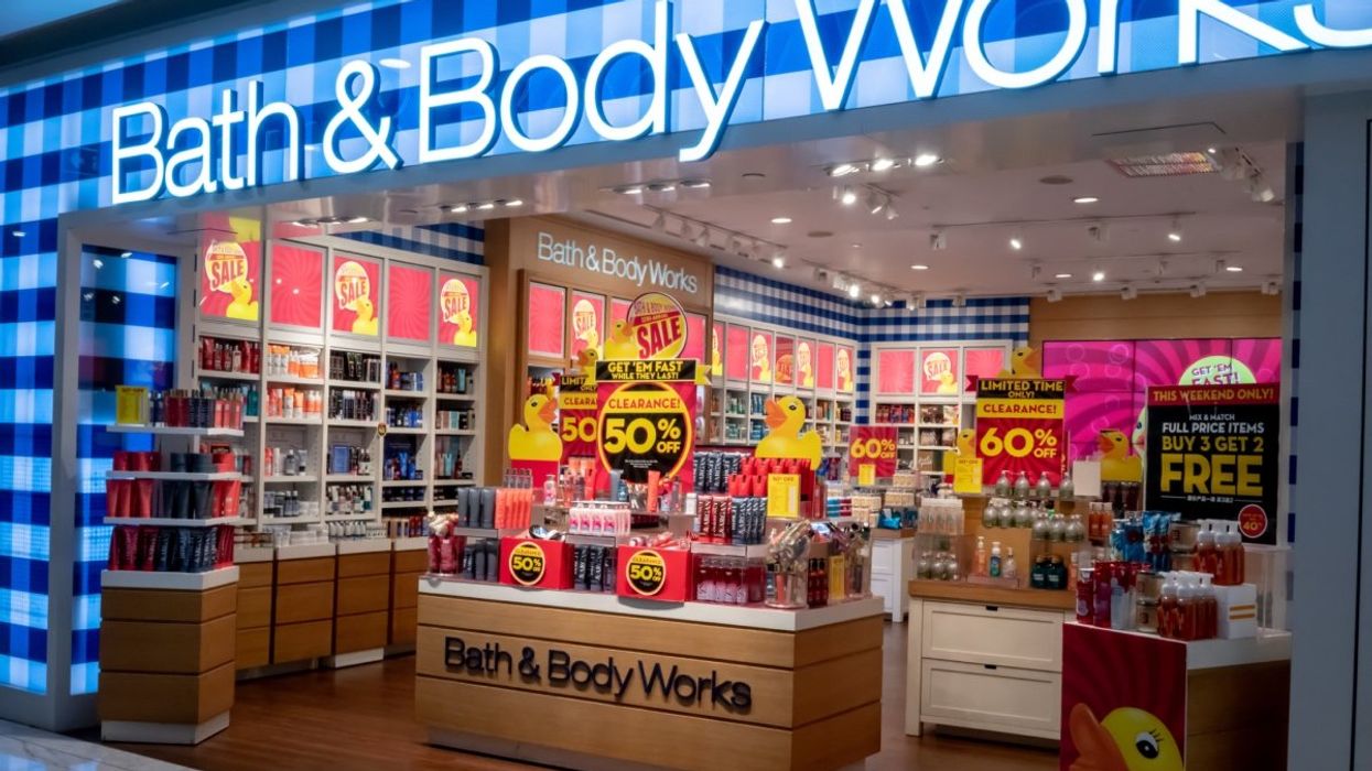 The storefront of a Bath and Body Works during a massive sale with tons of discount signs throughout the store.